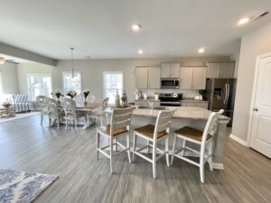 Elmsted kitchen, dining, and sunroom option in the model home by Boyd Homes.